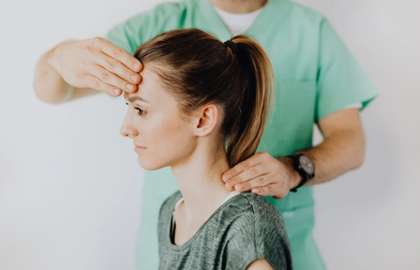 a person getting a therapeutic massage for a headache