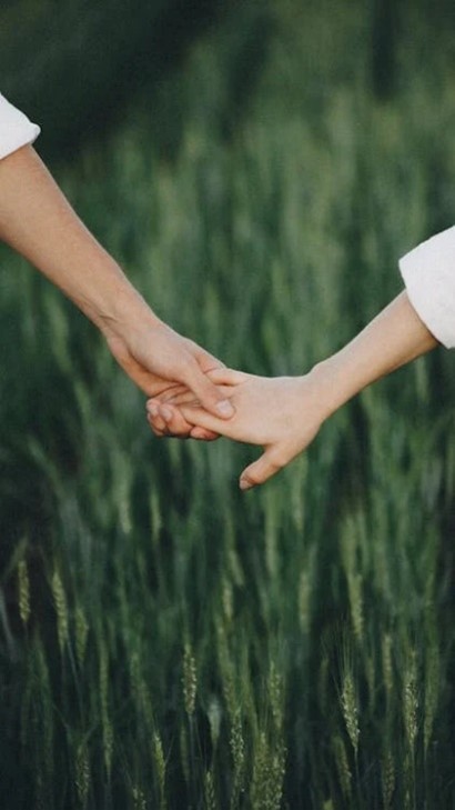: An image of a couple holding hands