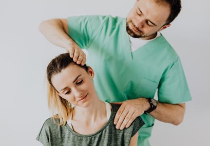 A Woman getting a shoulder massage