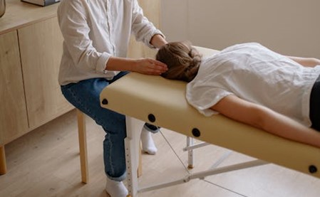 A woman getting a head massage