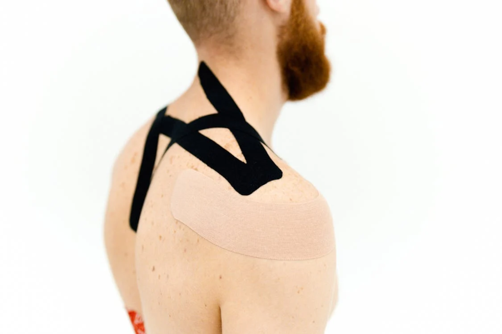 An image of tapes plastered on a man’s back