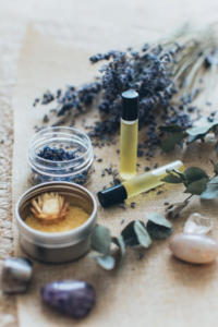 An image of lavender and massage oil bottles