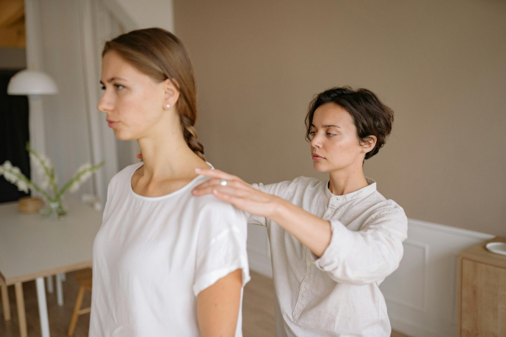 A massage therapist with a client