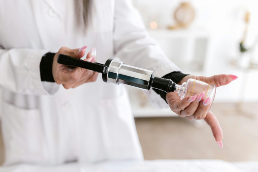 A woman holding equipment for cupping therapy