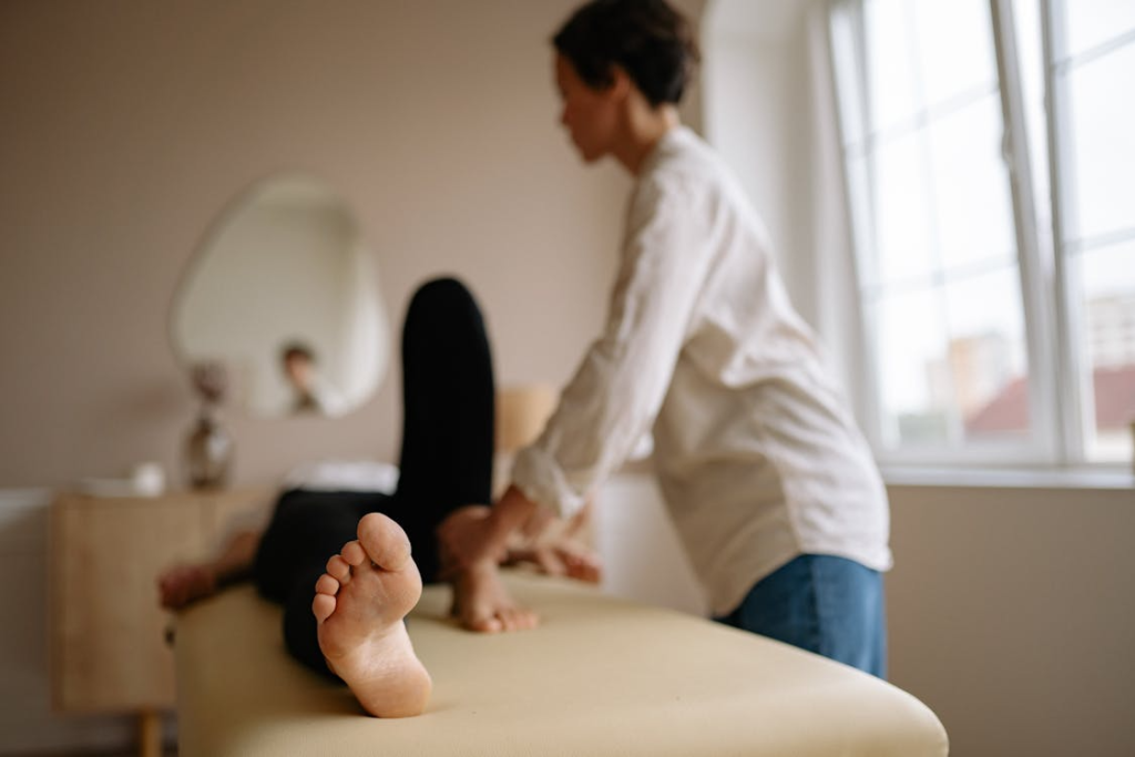 A registered massage therapist during a session with her client