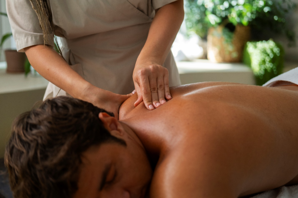 a person getting a shoulder massage from a massage therapist