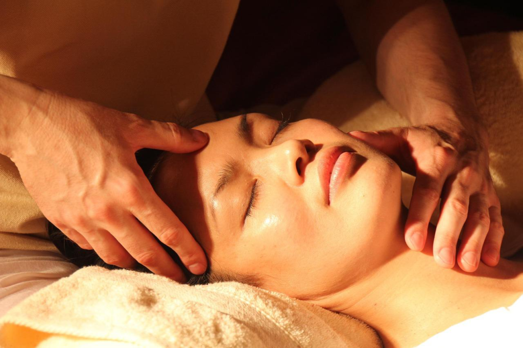 Close-up of a relaxing head and neck massage session.