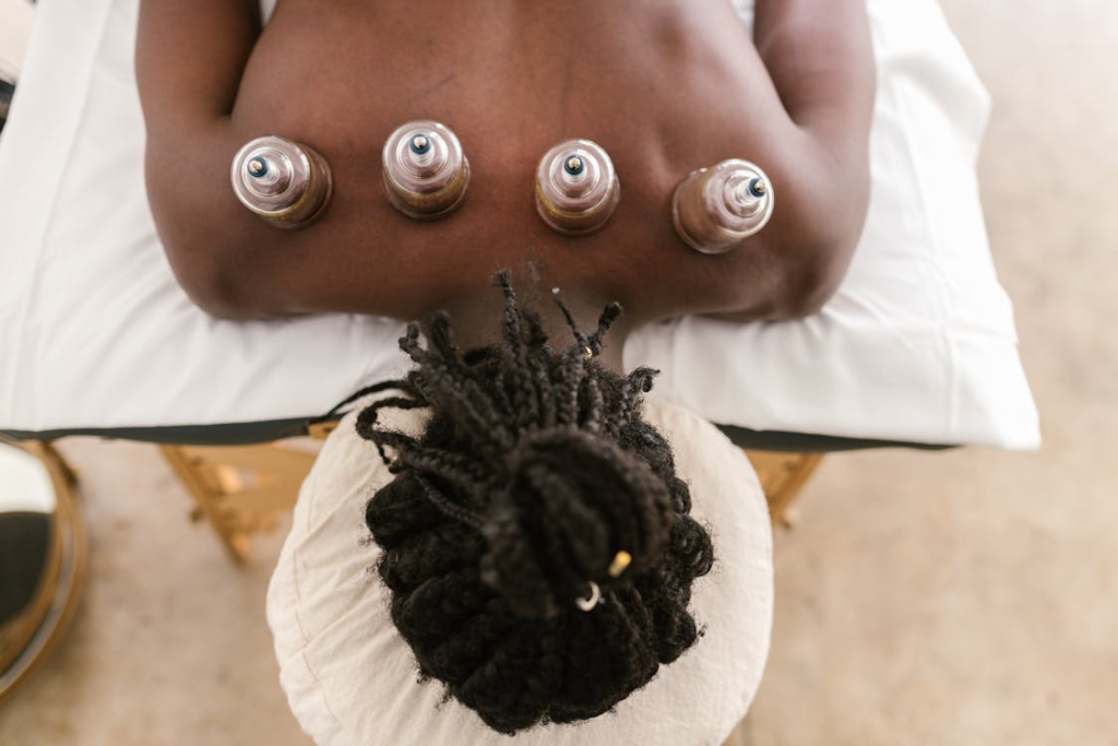 a man with cups on his back 