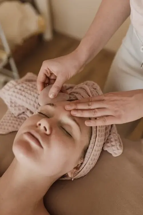a woman getting a Gua Sha massage