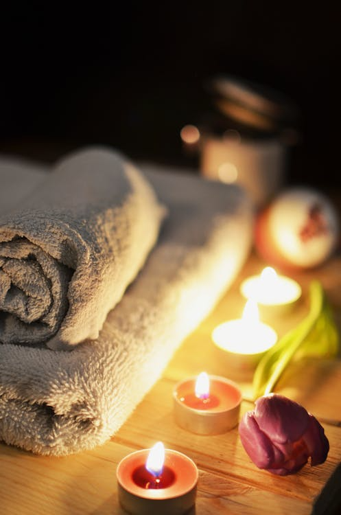 An image of candles and towels at a spa