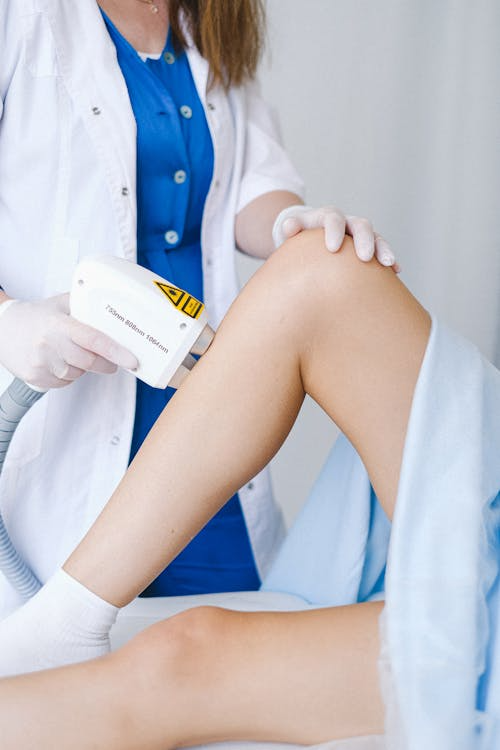 An image of a woman getting a laser hair removal treatment 