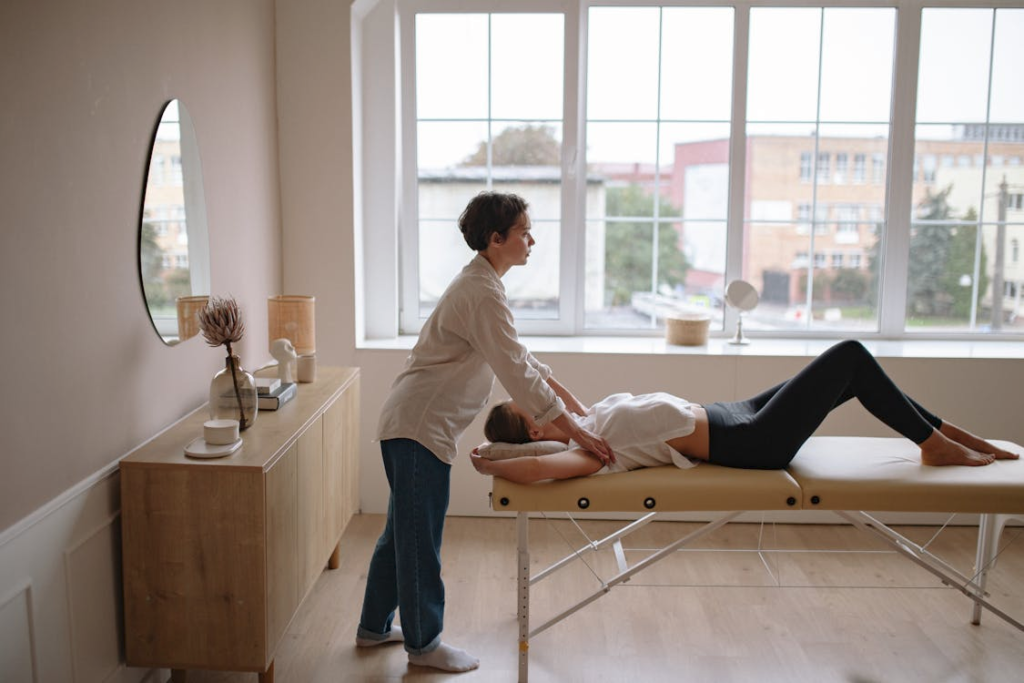 a client receiving a combined massage and manual osteopathy session