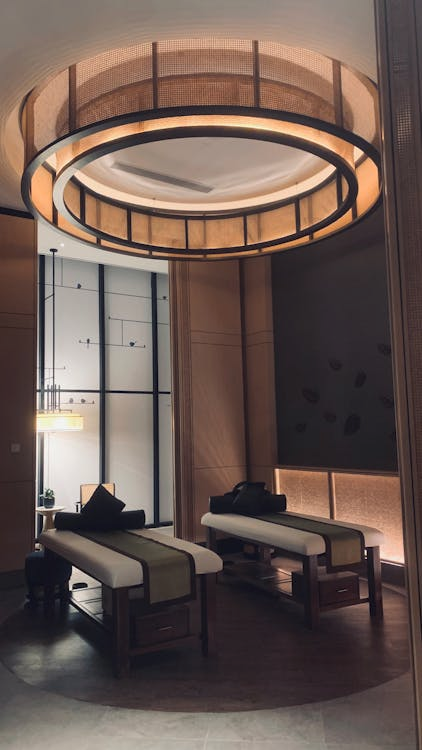 tranquil massage room with soft lighting and two massage tables