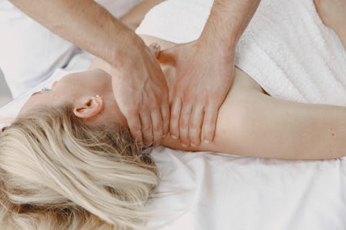 An image a woman getiing a neck massage in Edmonton