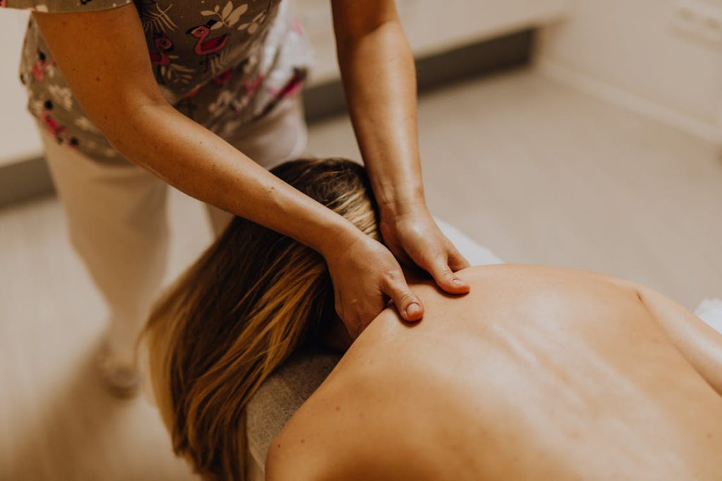 An image of a woman getting a neck and shoulder massage