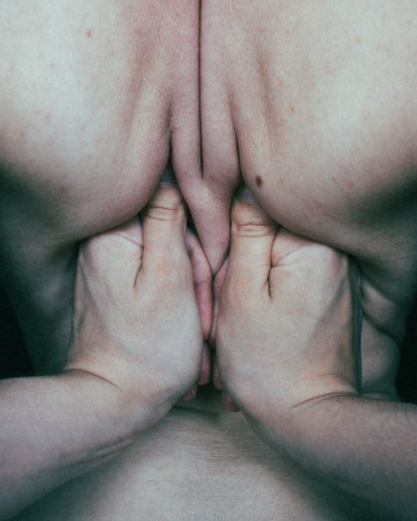 close-up of hands massaging the upper back and neck