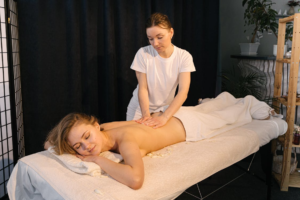 a person giving a woman a massage