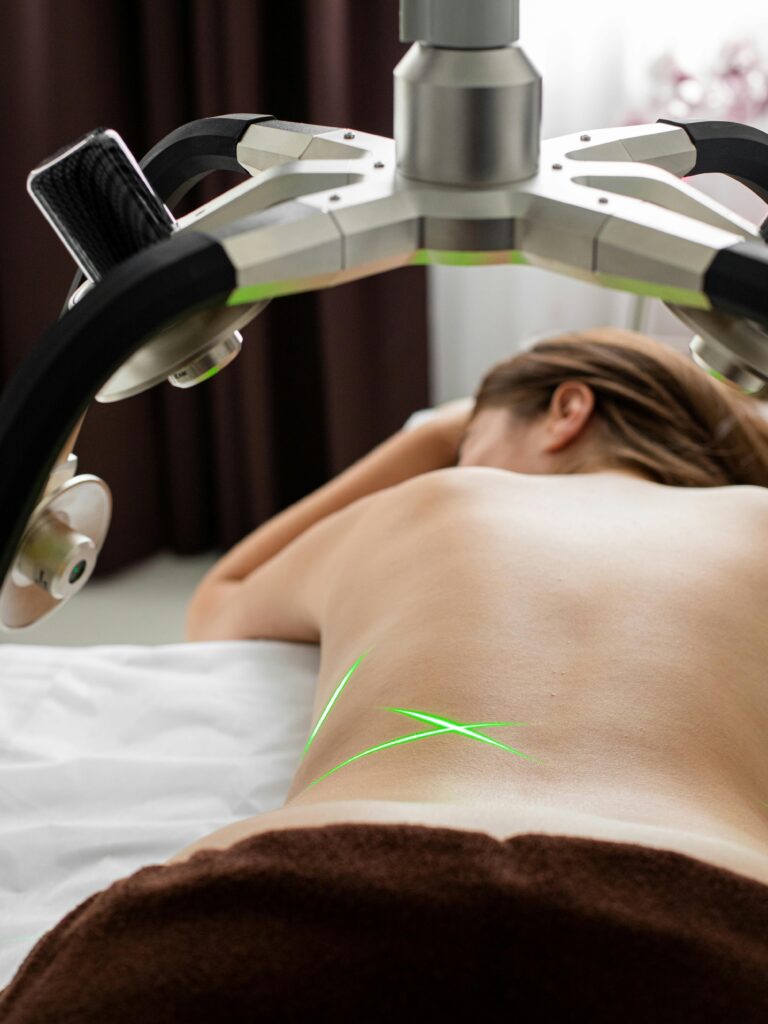 woman getting laser therapy to improve tissue repair