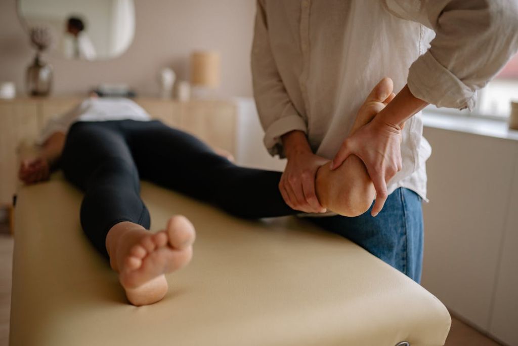 This photo shows a person getting a foot massage. 