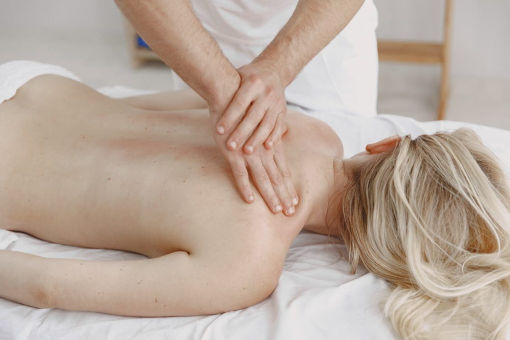 This photo shows a woman getting a massage. 