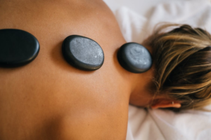 close-up of hot stones on a person's back