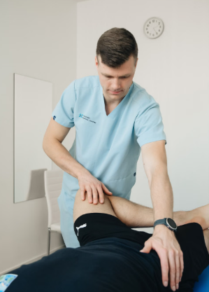 This image shows a therapist treating leg muscles.