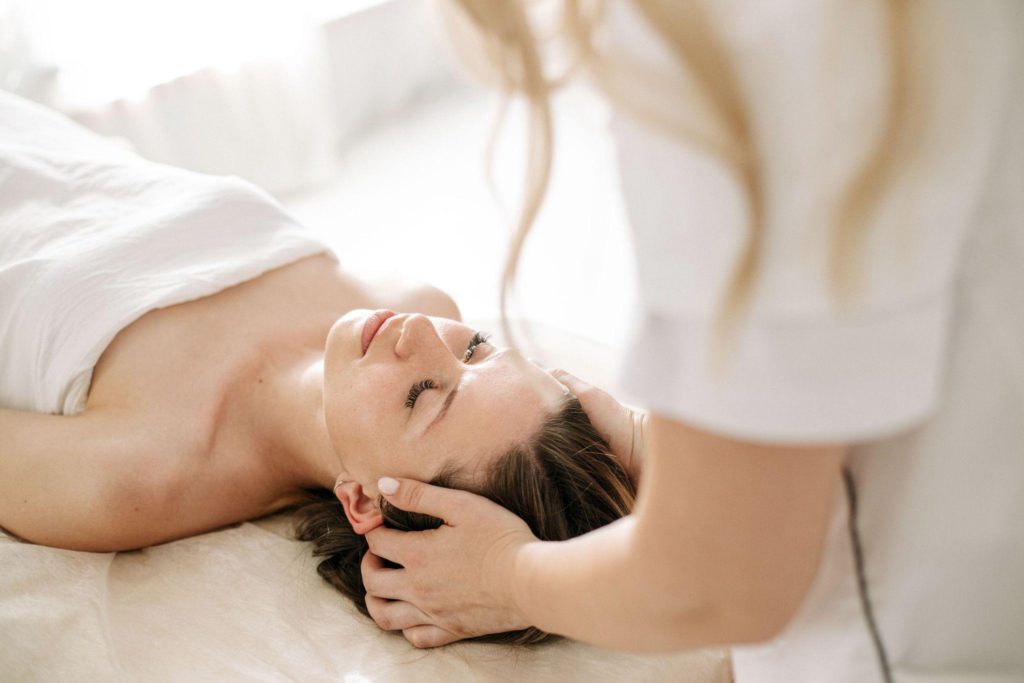 a woman receiving a head massage