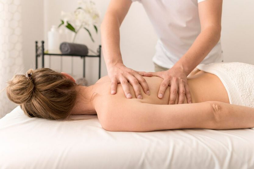 a massage therapist providing a relaxing back massage