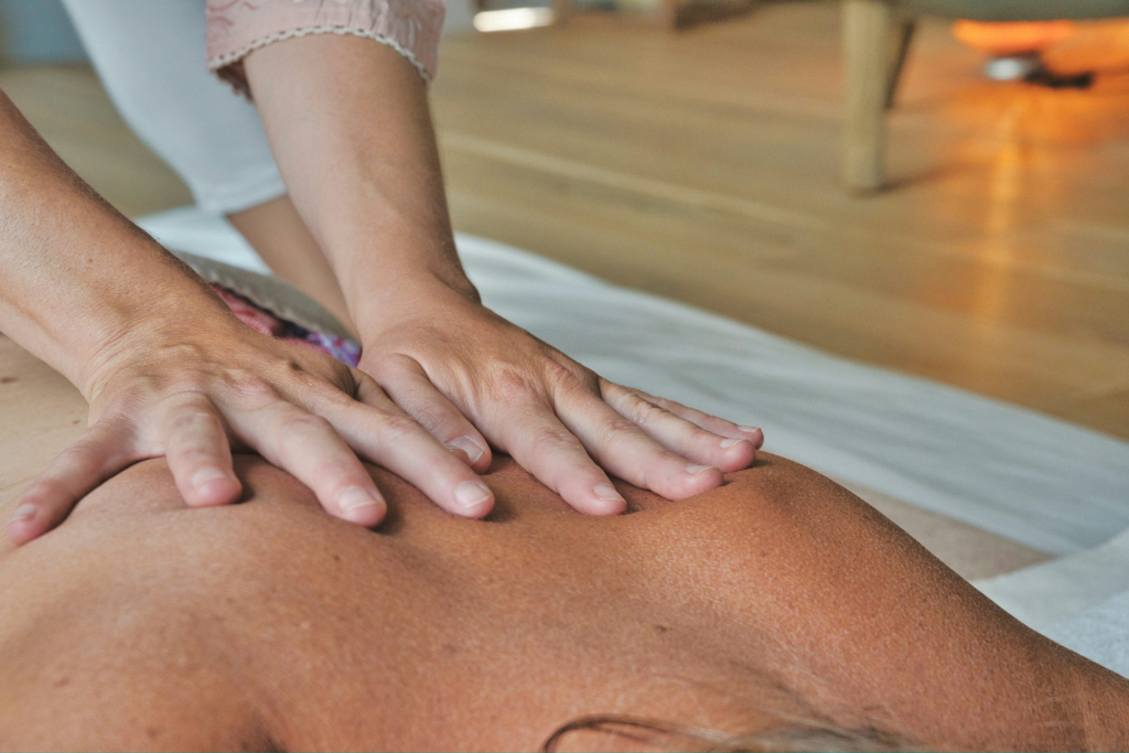 A person offering a massage to another. 
