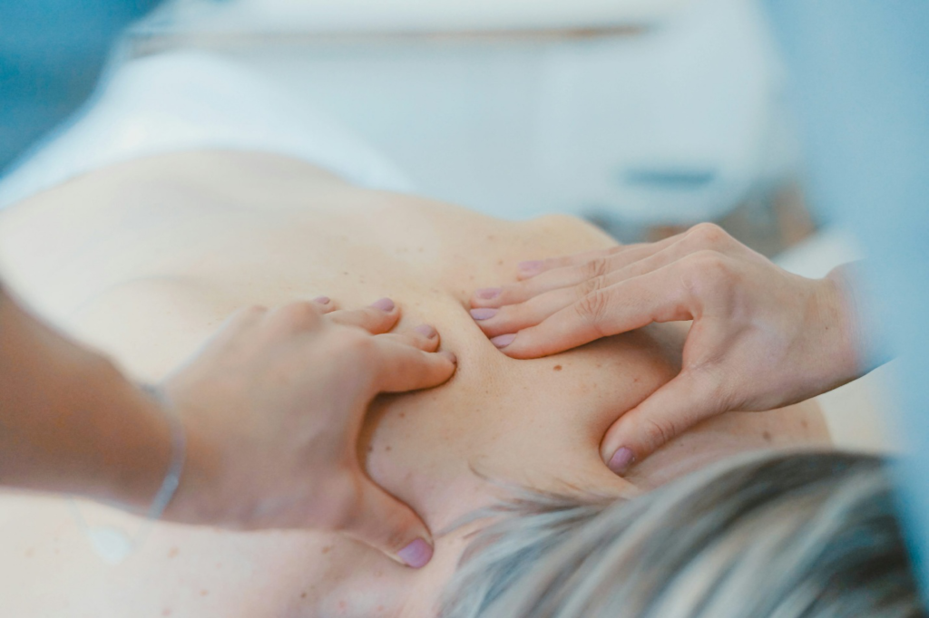 A person getting their backs massaged. 