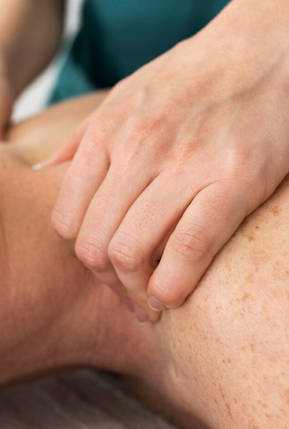 A person doing another’s back massage. 