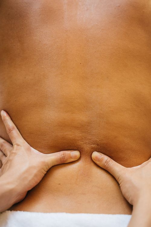 An image of a woman getting a back massage