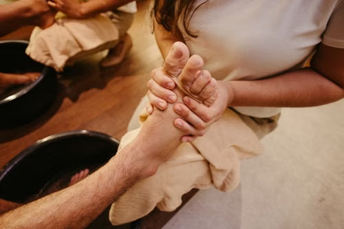 This photo shows a man getting a foot massage.