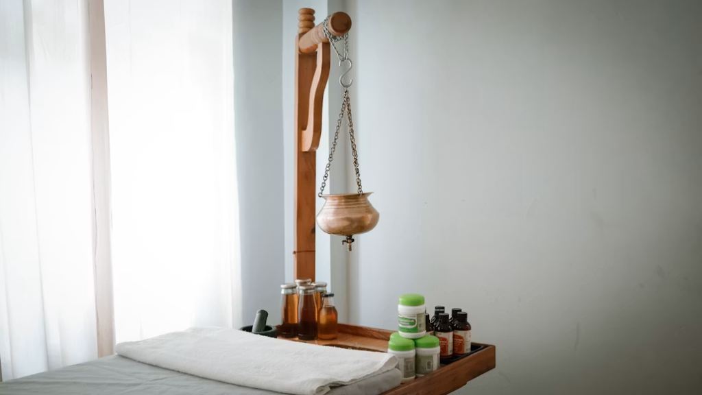 This photo shows a wooden shelf with some oil bottles.