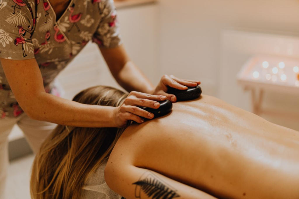 A person getting a hot stone massage in Edmonton.