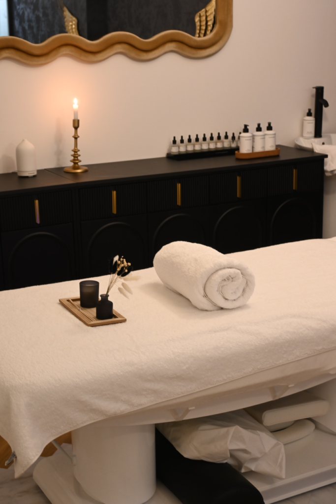 a massage room with a scented candle.