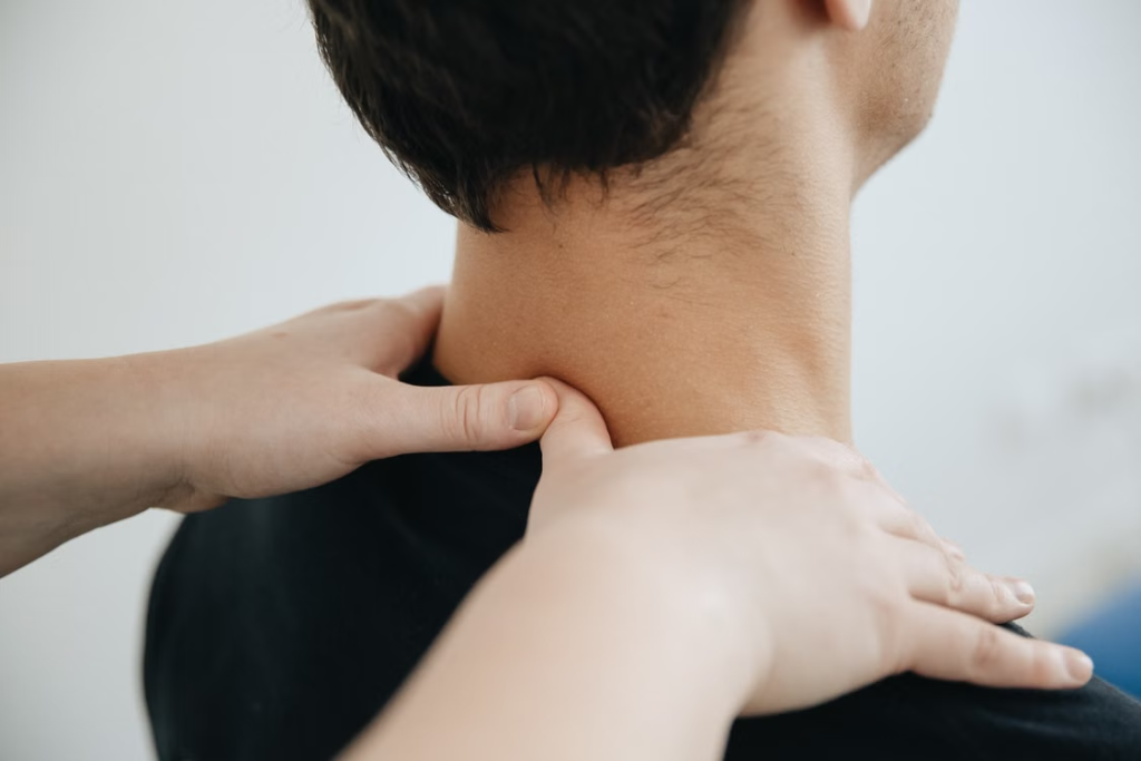 A person getting a neck massage from a professional.